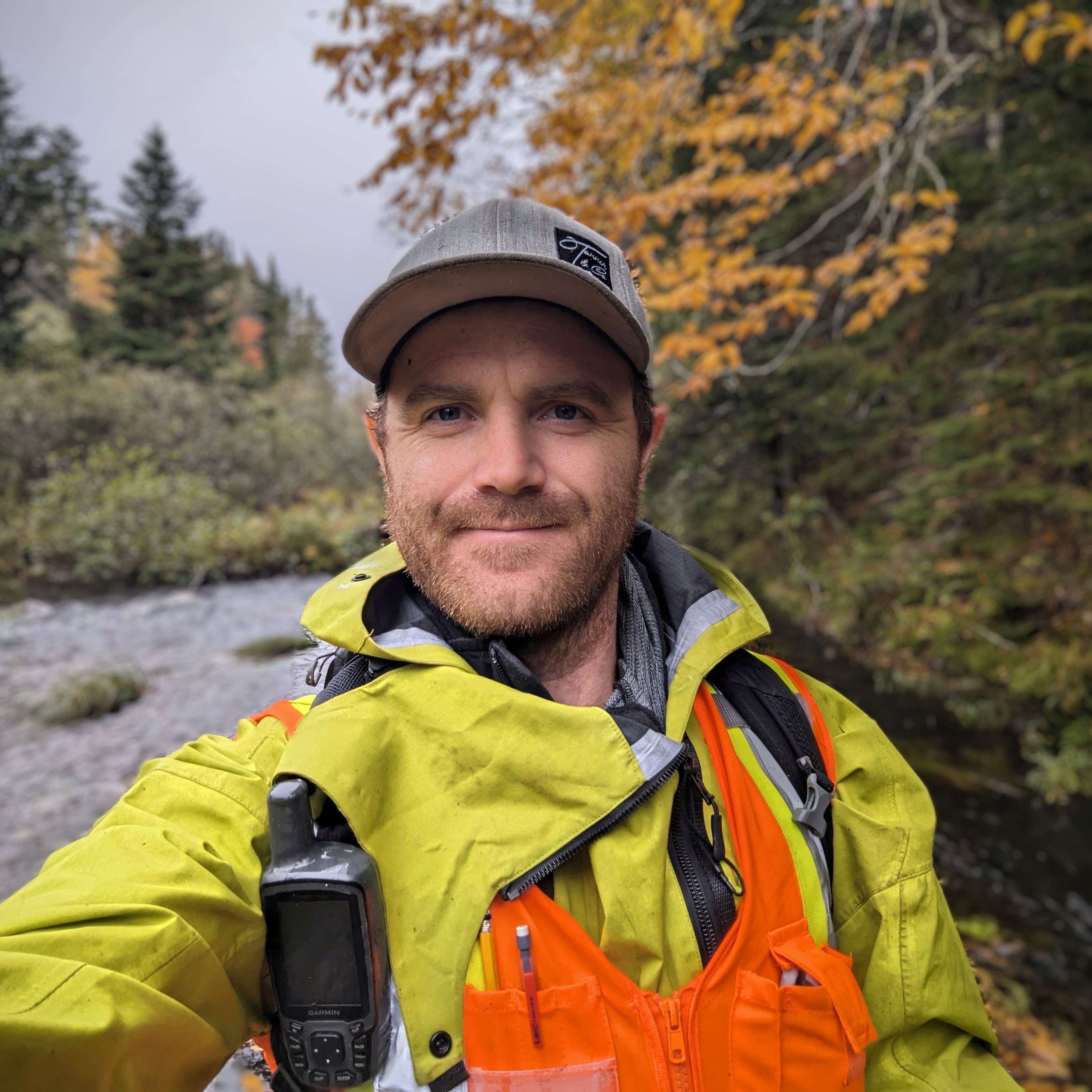 AquaHab environmental consultant conducting a fish habitat assessment in a Nova Scotia stream for a linear development project.